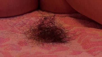 Play A fat girl shaves her hairy pussy and ass.